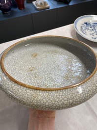 A Chinese ge-type brush washer, a pair of pink bowls, two plates and a saucer, Kangxi and later