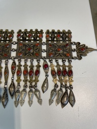 Three silver head ornaments and a chest ornament, Turkmenistan, 19/20th C.