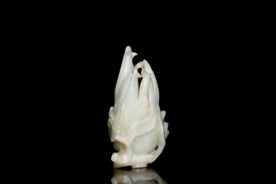 A fine Chinese white jade Buddha's hand on wooden stand, Qing