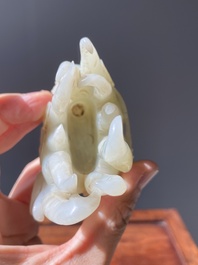 A fine Chinese white jade Buddha's hand on wooden stand, Qing