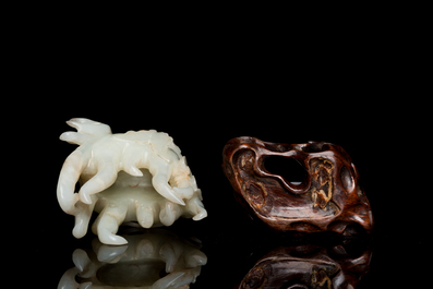 A fine Chinese white jade Buddha's hand on wooden stand, Qing