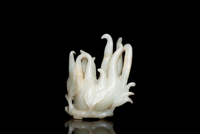 A fine Chinese white jade Buddha's hand on wooden stand, Qing