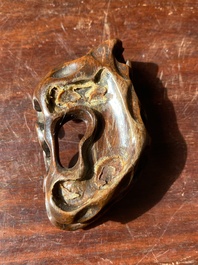 A fine Chinese white jade Buddha's hand on wooden stand, Qing