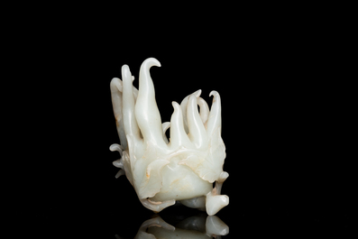 A fine Chinese white jade Buddha's hand on wooden stand, Qing