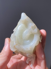 A fine Chinese white jade Buddha's hand on wooden stand, Qing