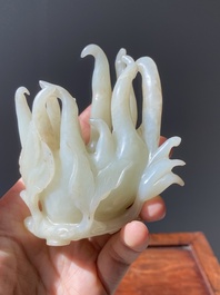 A fine Chinese white jade Buddha's hand on wooden stand, Qing