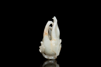 A fine Chinese white jade Buddha's hand on wooden stand, Qing