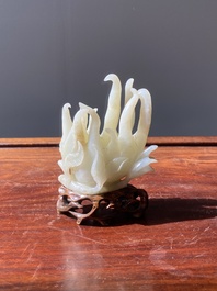 A fine Chinese white jade Buddha's hand on wooden stand, Qing