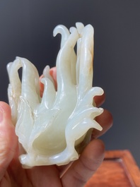 A fine Chinese white jade Buddha's hand on wooden stand, Qing