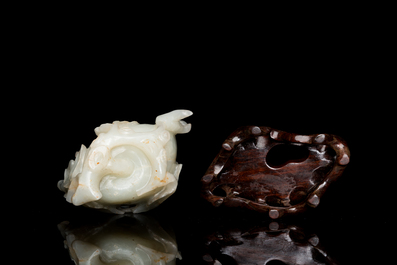 A fine Chinese white jade Buddha's hand on wooden stand, Qing