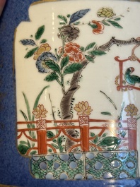 A pair of Chinese powder blue-ground famille verte vessels with a bird in a garden, Kangxi