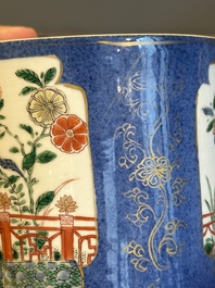 A pair of Chinese powder blue-ground famille verte vessels with a bird in a garden, Kangxi