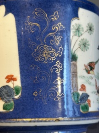 A pair of Chinese powder blue-ground famille verte vessels with a bird in a garden, Kangxi
