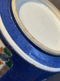 A pair of Chinese powder blue-ground famille verte vessels with a bird in a garden, Kangxi