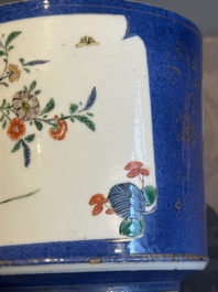A pair of Chinese powder blue-ground famille verte vessels with a bird in a garden, Kangxi