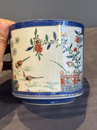 A pair of Chinese powder blue-ground famille verte vessels with a bird in a garden, Kangxi
