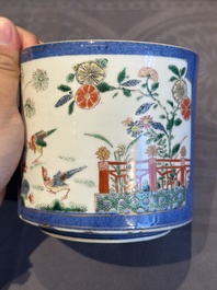 A pair of Chinese powder blue-ground famille verte vessels with a bird in a garden, Kangxi