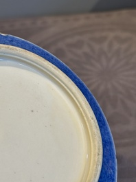 A pair of Chinese powder blue-ground famille verte vessels with a bird in a garden, Kangxi