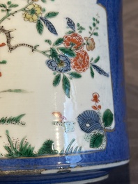 A pair of Chinese powder blue-ground famille verte vessels with a bird in a garden, Kangxi
