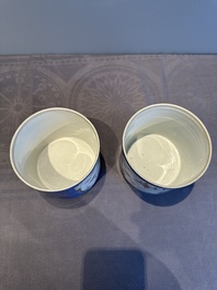 A pair of Chinese powder blue-ground famille verte vessels with a bird in a garden, Kangxi