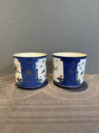 A pair of Chinese powder blue-ground famille verte vessels with a bird in a garden, Kangxi