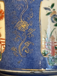 A pair of Chinese powder blue-ground famille verte vessels with a bird in a garden, Kangxi