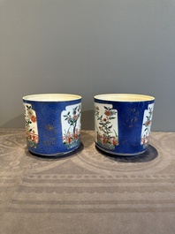A pair of Chinese powder blue-ground famille verte vessels with a bird in a garden, Kangxi