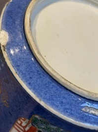 A pair of Chinese powder blue-ground famille verte vessels with a bird in a garden, Kangxi