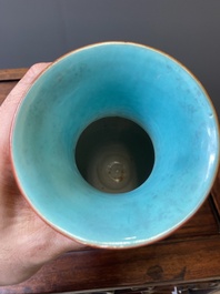 A pair of Chinese famille rose coral-red-ground vases with playing boys, 18/19th C.