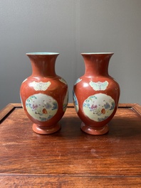 A pair of Chinese famille rose coral-red-ground vases with playing boys, 18/19th C.