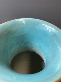 A pair of Chinese famille rose coral-red-ground vases with playing boys, 18/19th C.