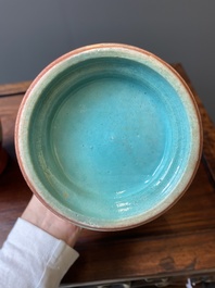 A pair of Chinese famille rose coral-red-ground vases with playing boys, 18/19th C.