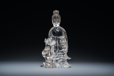 A Chinese rock crystal sculpture of Lan Caihe on wooden stand, 19th C.