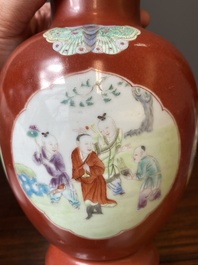A pair of Chinese famille rose coral-red-ground vases with playing boys, 18/19th C.