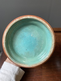 A pair of Chinese famille rose coral-red-ground vases with playing boys, 18/19th C.