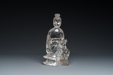 A Chinese rock crystal sculpture of Lan Caihe on wooden stand, 19th C.