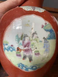 A pair of Chinese famille rose coral-red-ground vases with playing boys, 18/19th C.