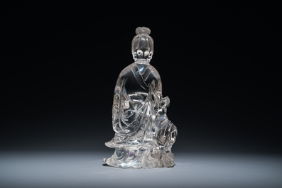 A Chinese rock crystal sculpture of Lan Caihe on wooden stand, 19th C.