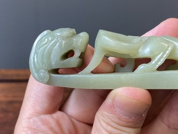 Two Chinese white and celadon jade belt hooks, Qing