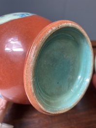 A pair of Chinese famille rose coral-red-ground vases with playing boys, 18/19th C.