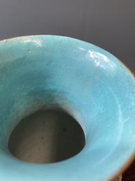 A pair of Chinese famille rose coral-red-ground vases with playing boys, 18/19th C.