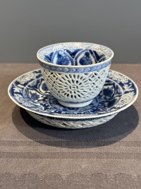 A Chinese blue and white reticulated double-walled cup and saucer, lingzhi mark, Kangxi