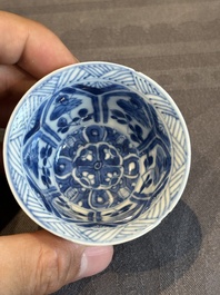 A Chinese blue and white reticulated double-walled cup and saucer, lingzhi mark, Kangxi