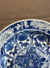A Chinese blue and white reticulated double-walled cup and saucer, lingzhi mark, Kangxi
