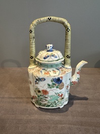 A Chinese famille verte 'flower and butterfly' teapot with an upright handle, Kangxi