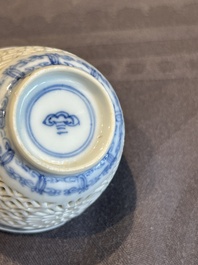 A Chinese blue and white reticulated double-walled cup and saucer, lingzhi mark, Kangxi