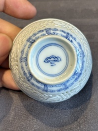 A Chinese blue and white reticulated double-walled cup and saucer, lingzhi mark, Kangxi