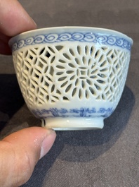 A Chinese blue and white reticulated double-walled cup and saucer, lingzhi mark, Kangxi