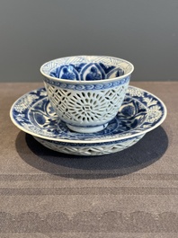 A Chinese blue and white reticulated double-walled cup and saucer, lingzhi mark, Kangxi