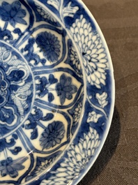 A Chinese blue and white reticulated double-walled cup and saucer, lingzhi mark, Kangxi